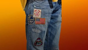 Image of a man wearing jeans with patches lucky Image of a man wearing jeans with patches lucky
