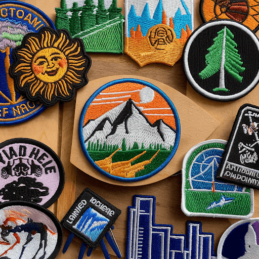 Various custom patches placed on a table