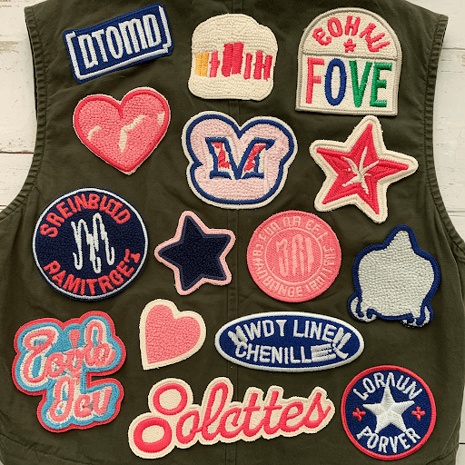 Various custom chenille patches on a vest Various custom chenille patches on a vest