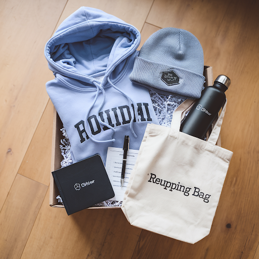 marketing swag box with multiple items with name patch on it