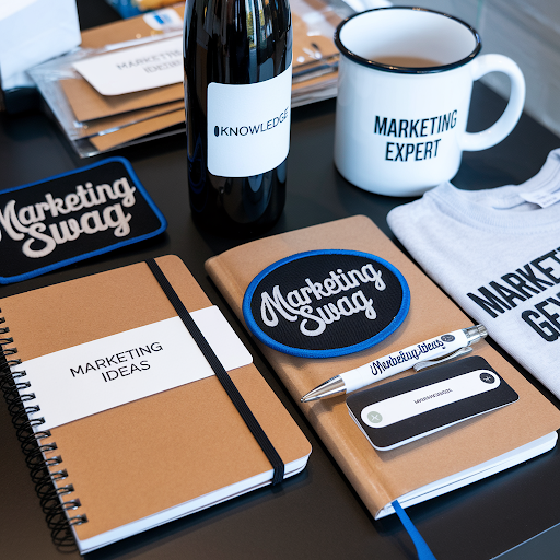 various marketing swag goodies with custom patches on it