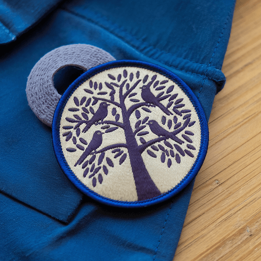 clothing patch with a hook and loop backing