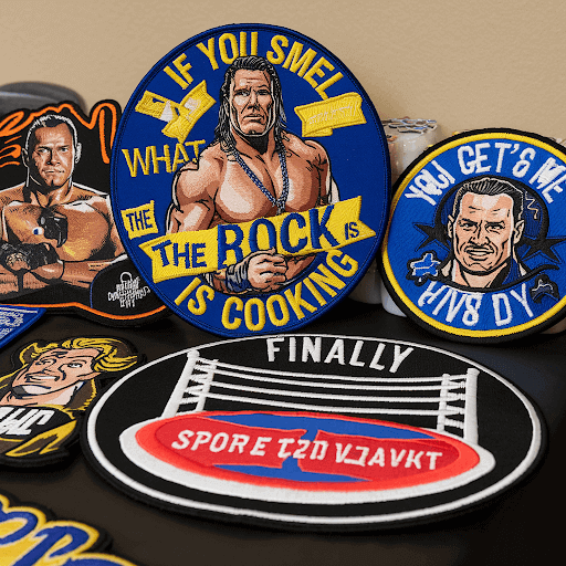 A table with multiple WWE custom patches