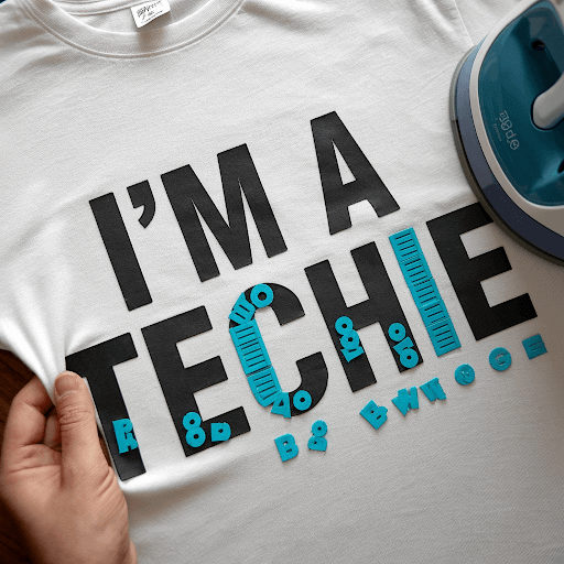 A white t shirt with the text I'm a techie ironed on it