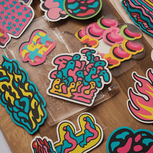 A wooden board with a variety of funky, vibrant custom patches